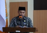 Bupati Indragiri Hilir (Inhil) H Herman, diwakili oleh Staf Ahli Bupati Muammar Qhadaffi dalam sambutannya menyampaikan pentingnya menjaga semangat juang kebangsaan. | Foto: Diskominfo Inhil
